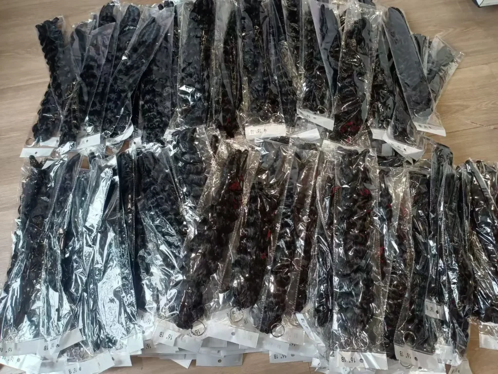Assorted bulk Wholesale Human Hair wigs and hair bundles display