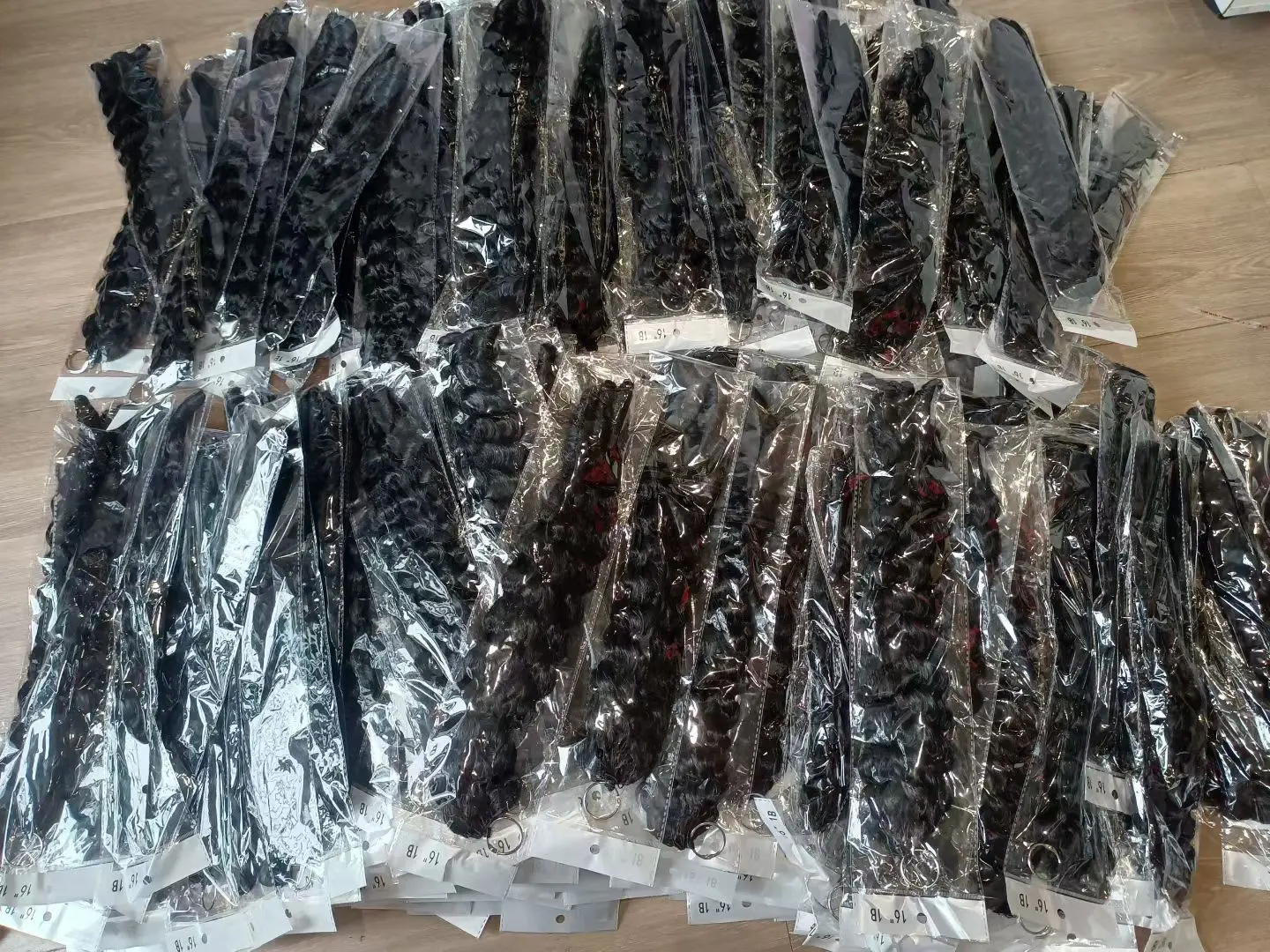 Assorted bulk Wholesale Human Hair wigs and hair bundles display